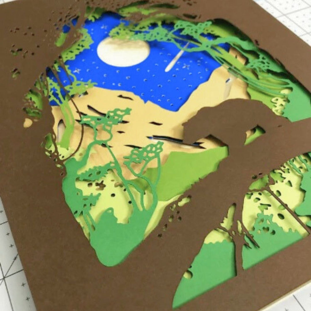 Handcrafted Forest Bear Layered Wall Art with intricate paper layers creating a 3D forest scene. A stunning DIY Cricut project for nature-inspired home decor.