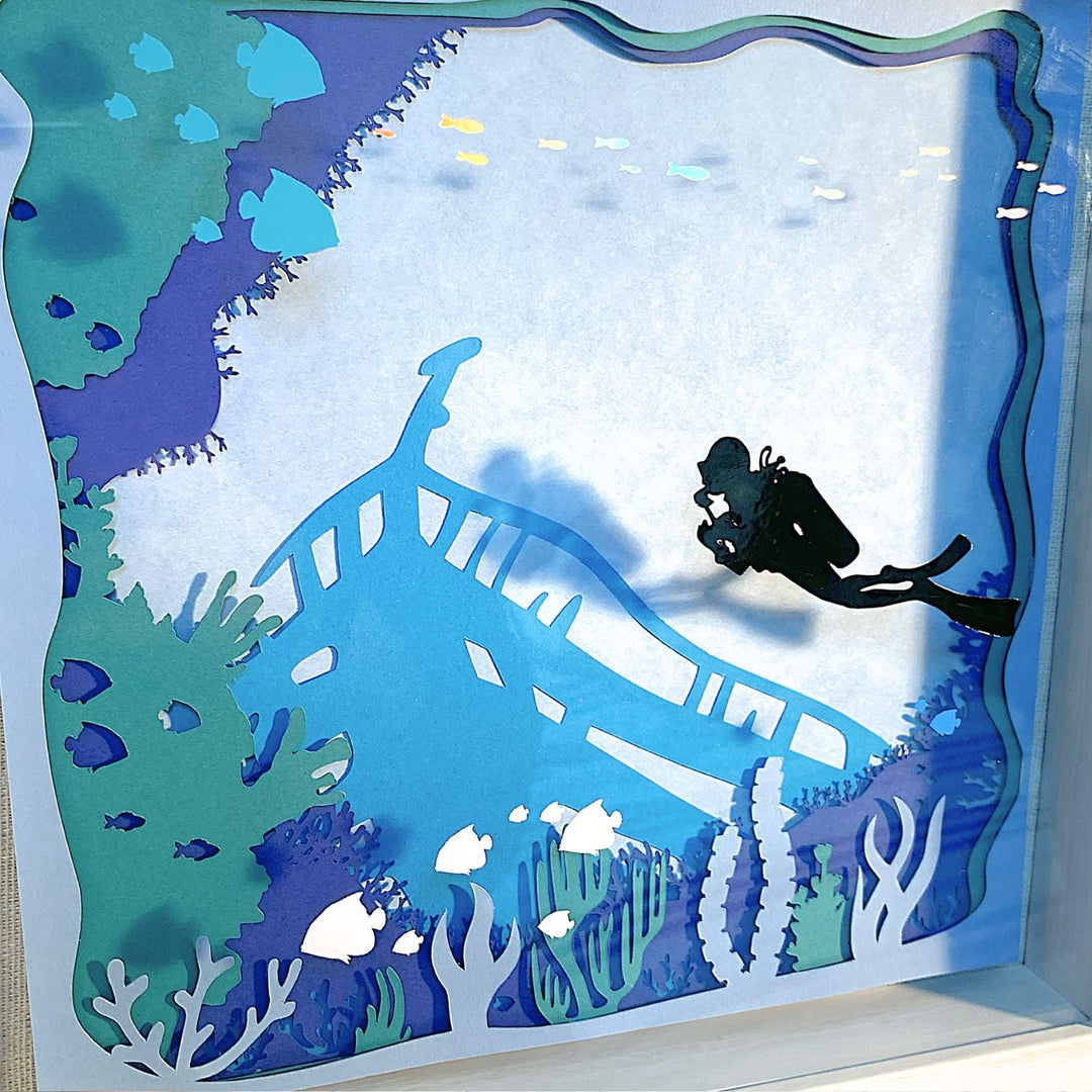 Completed Scuba Diver Layered Wall Art featuring a detailed 3D paper design with an underwater scene, layered cardstock, and vinyl accents. Perfect for ocean-themed decor or gifts.