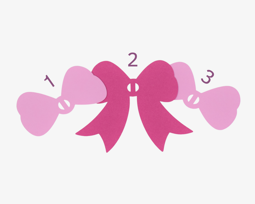 a number of pink bows on a white background